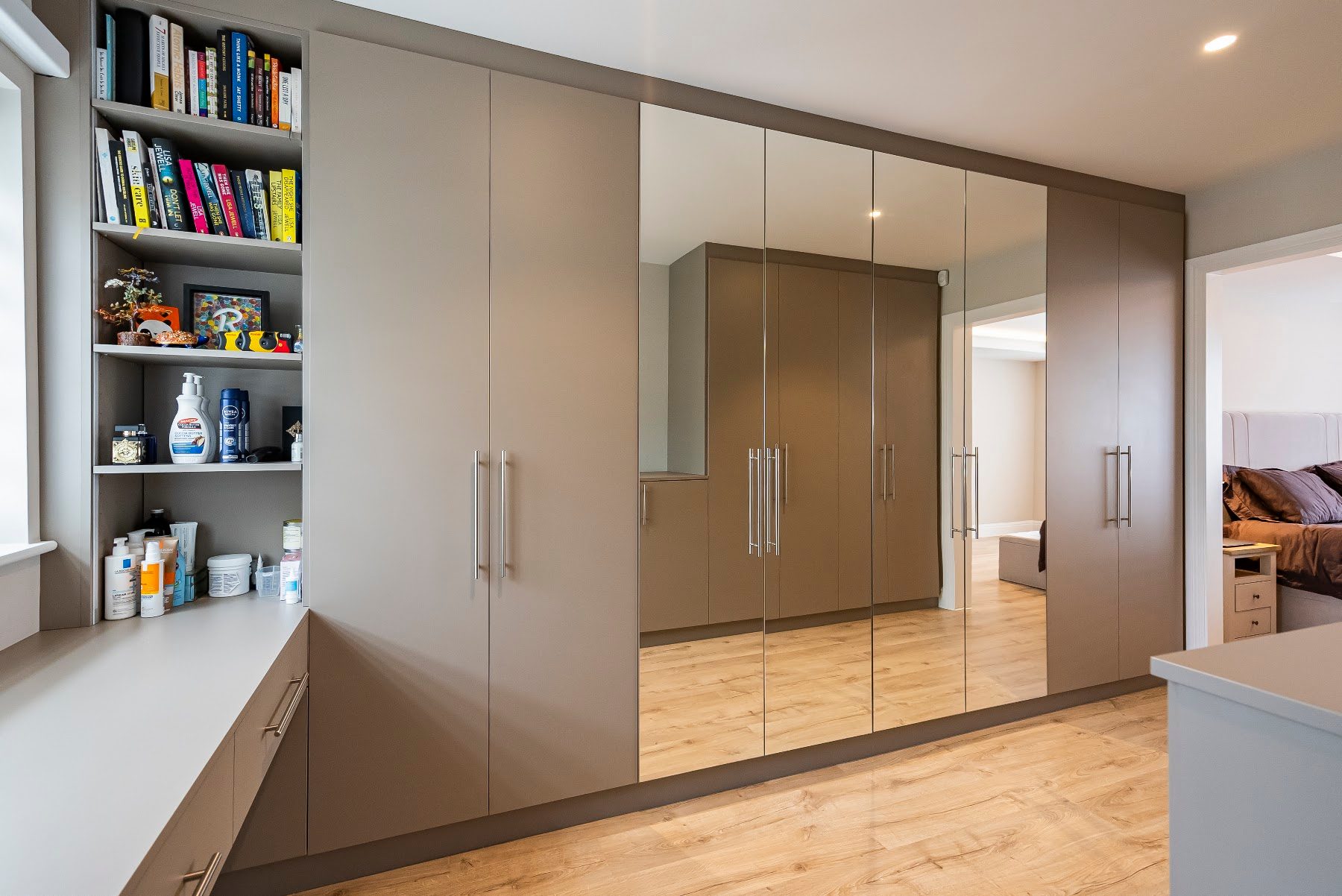 Bespoke fitted wardrobes with integrated drawers and concealed storage
